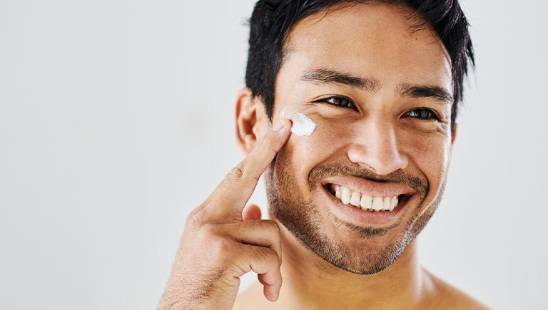 a close up of a man smiling for the camera